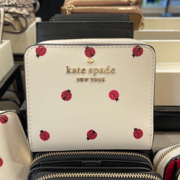 kate spade Handbags - Kate Spade Staci Small Ladybug Zip Around Wallet
COLOR:
Cream Multi